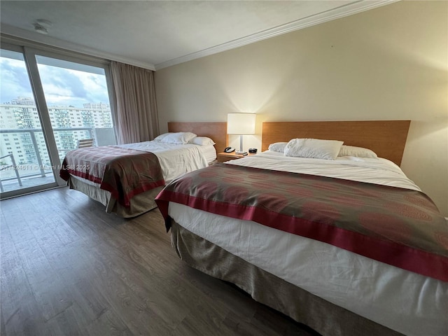 19201 Collins Ave Unit 1137, Sunny Isles Beach, FL 33160 - bedroom featuring wood finished floors, ornamental molding, access to outside, a city view, and a wall of windows