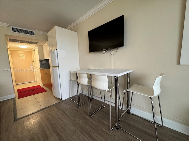 19201 Collins Ave Unit 1137, Sunny Isles Beach, FL 33160 - dining room featuring wood finished floors and ornamental molding