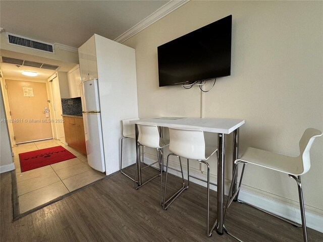 19201 Collins Ave Unit 1137, Sunny Isles Beach, FL 33160 - dining room with crown molding and dark wood-type flooring