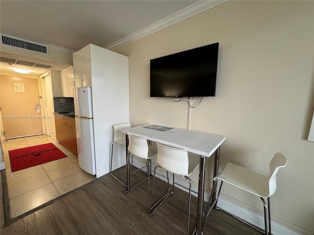 19201 Collins Ave Unit 1137, Sunny Isles Beach, FL 33160 - home office with ornamental molding and light wood-style flooring