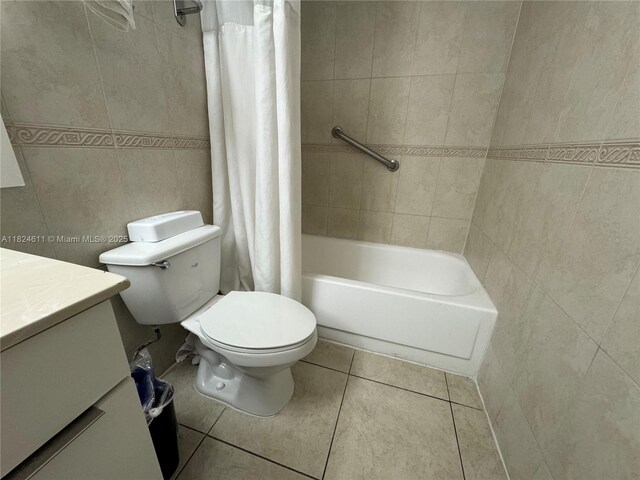19201 Collins Ave Unit 1137, Sunny Isles Beach, FL 33160 - bathroom with vanity, tile walls, tile patterned floors, and shower / bath combo