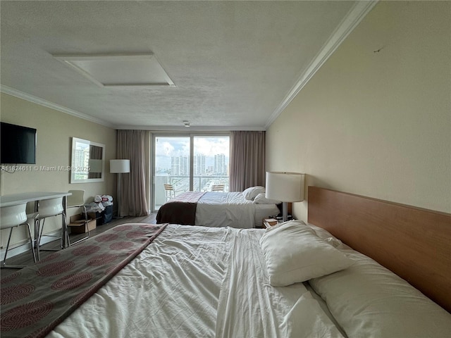 19201 Collins Ave Unit 1137, Sunny Isles Beach, FL 33160 - bedroom featuring attic access, crown molding, and a textured ceiling