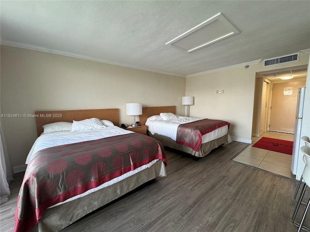 19201 Collins Ave Unit 1137, Sunny Isles Beach, FL 33160 - bedroom featuring attic access, ornamental molding, and wood finished floors