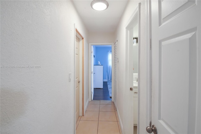 6459 Evans St, Hollywood, FL 33024 - corridor featuring light tile patterned floors and a textured wall