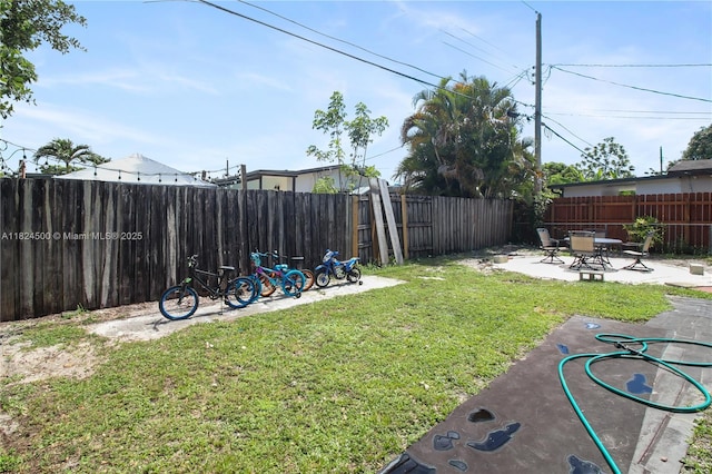 6459 Evans St, Hollywood, FL 33024 - fenced backyard with a patio area