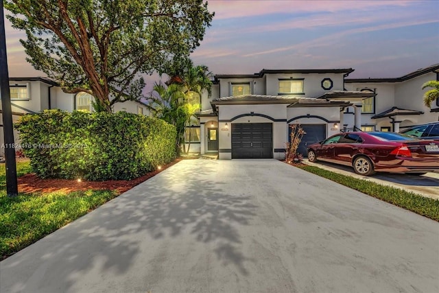 12926 SW 50th St, Miramar, FL 33027 - mediterranean / spanish-style home with driveway, stucco siding, and an attached garage