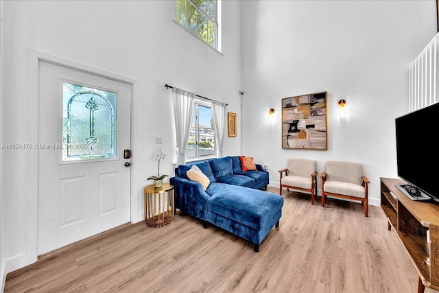 12926 SW 50th St, Miramar, FL 33027 - living room featuring light wood finished floors and a towering ceiling