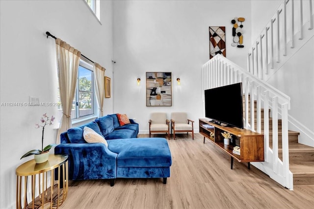 12926 SW 50th St, Miramar, FL 33027 - living area with stairs, wood finished floors, and a towering ceiling