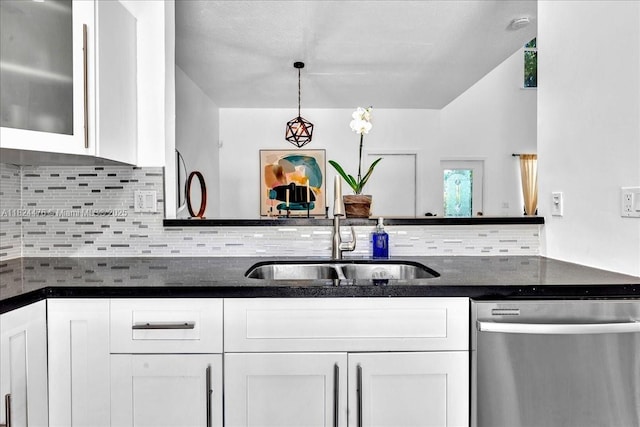 12926 SW 50th St, Miramar, FL 33027 - kitchen with stainless steel dishwasher, white cabinetry, tasteful backsplash, dark stone countertops, and glass insert cabinets
