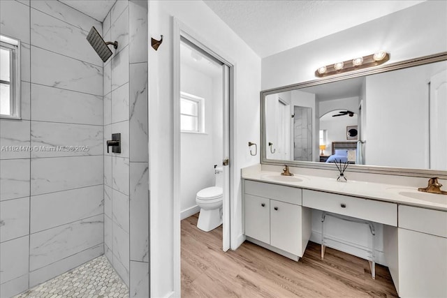 12926 SW 50th St, Miramar, FL 33027 - ensuite bathroom with double vanity, a marble finish shower, and wood finished floors