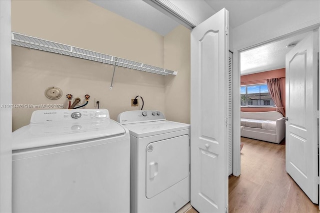 12926 SW 50th St, Miramar, FL 33027 - laundry room featuring light wood-style floors and washing machine and dryer
