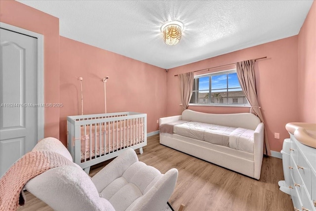 12926 SW 50th St, Miramar, FL 33027 - bedroom with wood finished floors and a textured ceiling