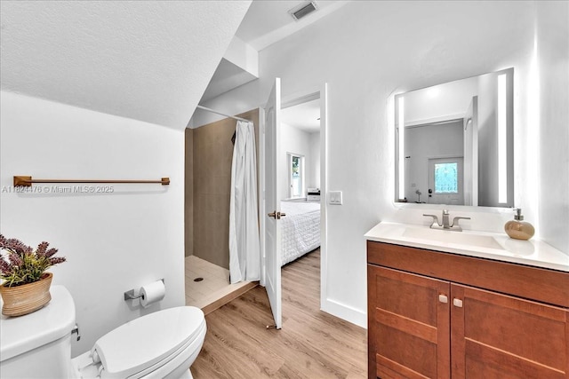 12926 SW 50th St, Miramar, FL 33027 - bathroom with a tile shower, vanity, and wood finished floors