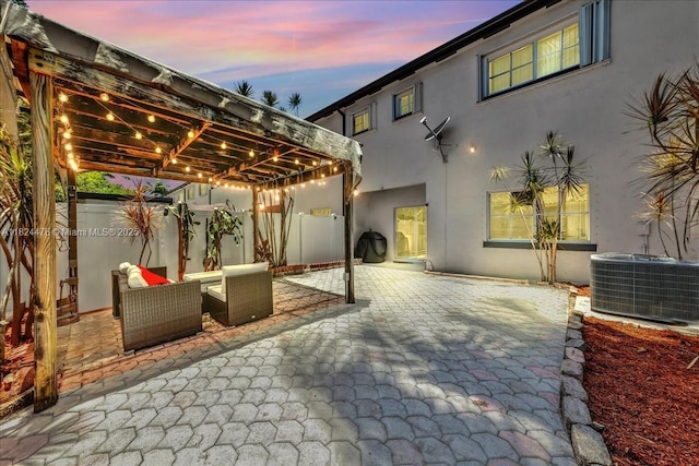 12926 SW 50th St, Miramar, FL 33027 - patio terrace at dusk with a pergola, a patio area, and a fenced backyard
