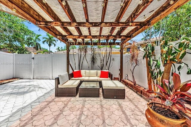 12926 SW 50th St, Miramar, FL 33027 - fenced backyard featuring a patio, an outdoor hangout area, and a gate