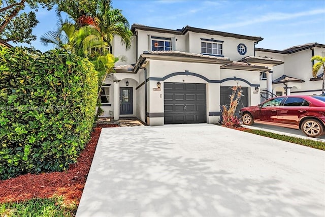 12926 SW 50th St, Miramar, FL 33027 - mediterranean / spanish home featuring stucco siding, driveway, a garage, and a tiled roof