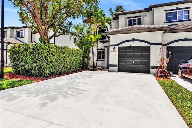 12926 SW 50th St, Miramar, FL 33027 - view of front facade with stucco siding, a tile roof, and concrete driveway