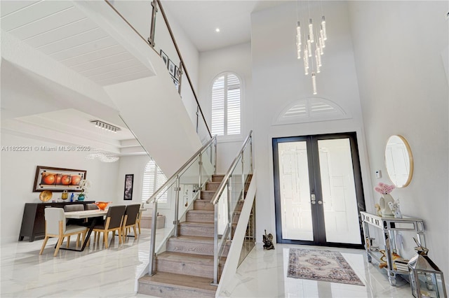 8965 NW 174th Ln, Hialeah, FL 33018 - entryway featuring stairway, light marble finish floors, a towering ceiling, recessed lighting, and french doors
