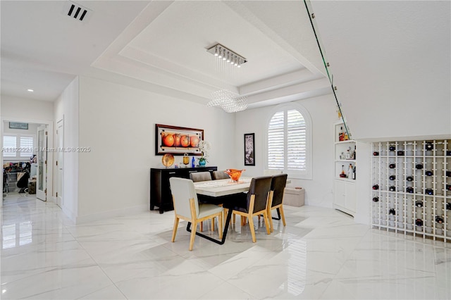 8965 NW 174th Ln, Hialeah, FL 33018 - dining area featuring light marble finish floors, a raised ceiling, and recessed lighting