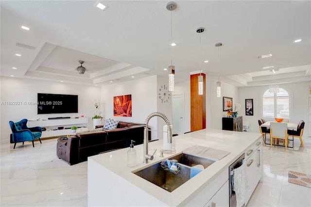 8965 NW 174th Ln, Hialeah, FL 33018 - kitchen with a raised ceiling, pendant lighting, white cabinetry, stainless steel dishwasher, and light countertops