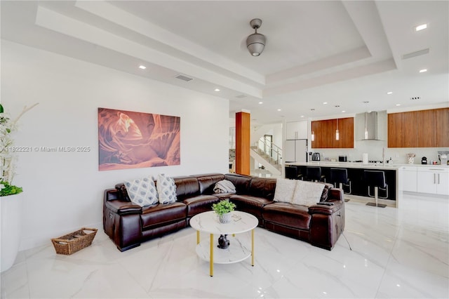 8965 NW 174th Ln, Hialeah, FL 33018 - living area featuring a raised ceiling, stairway, recessed lighting, and light marble finish flooring