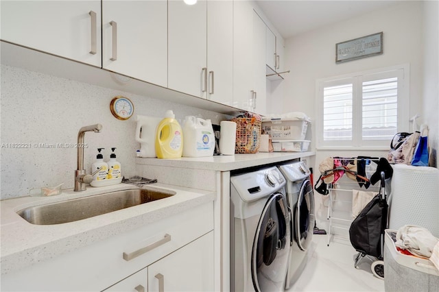 8965 NW 174th Ln, Hialeah, FL 33018 - laundry area featuring washer and dryer and cabinet space