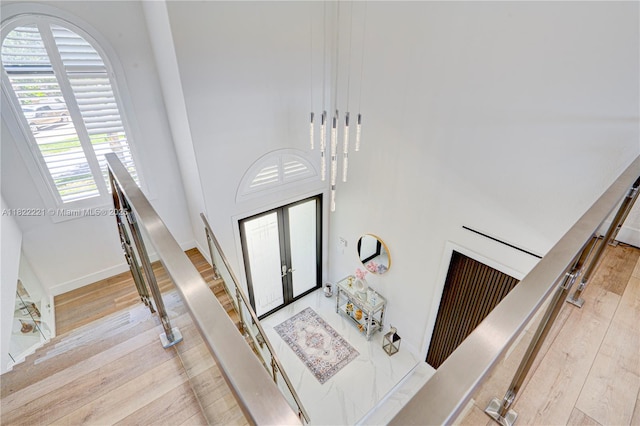 8965 NW 174th Ln, Hialeah, FL 33018 - stairway with wood finished floors and a towering ceiling