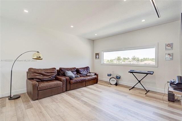 8965 NW 174th Ln, Hialeah, FL 33018 - living room featuring light wood-style floors and recessed lighting