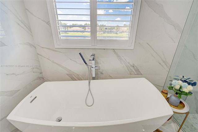 8965 NW 174th Ln, Hialeah, FL 33018 - bathroom with a soaking tub and healthy amount of natural light
