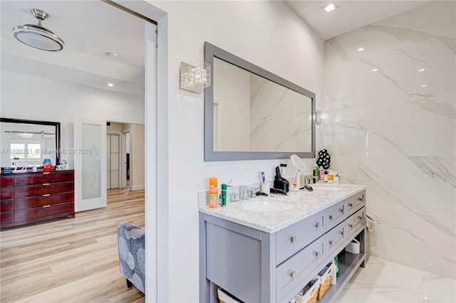 8965 NW 174th Ln, Hialeah, FL 33018 - bathroom with double vanity and wood finished floors