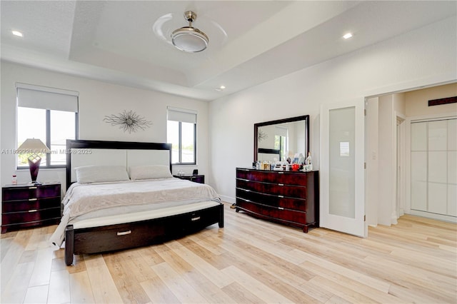 8965 NW 174th Ln, Hialeah, FL 33018 - bedroom with light wood finished floors, a tray ceiling, and recessed lighting