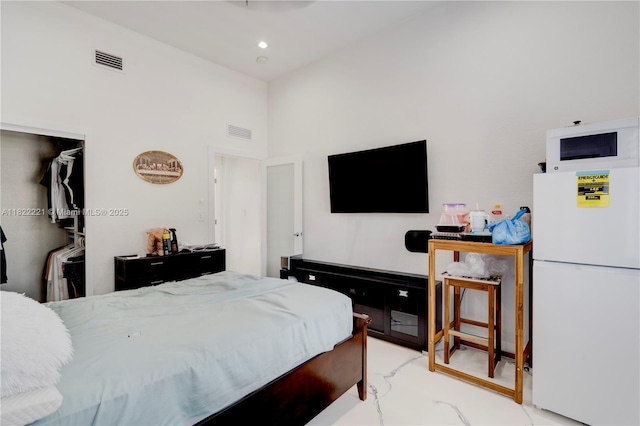 8965 NW 174th Ln, Hialeah, FL 33018 - bedroom with freestanding refrigerator and a towering ceiling