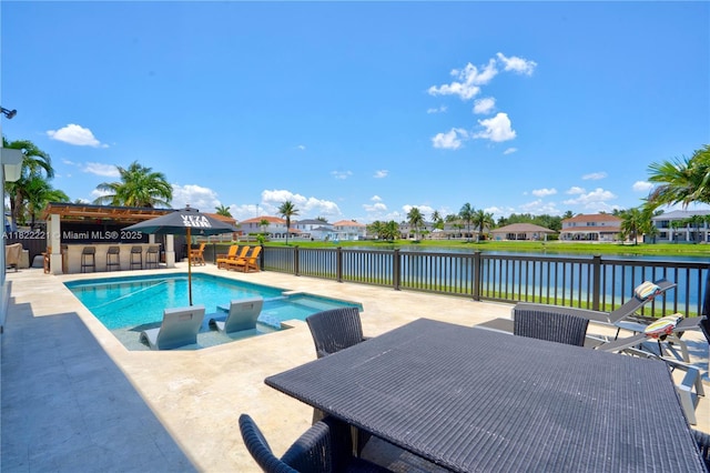 8965 NW 174th Ln, Hialeah, FL 33018 - view of pool featuring a water view, a patio, outdoor dining area, and a residential view