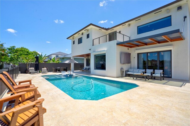 8965 NW 174th Ln, Hialeah, FL 33018 - view of swimming pool featuring an outdoor hangout area, a patio area, a fenced backyard, and a pool with connected hot tub
