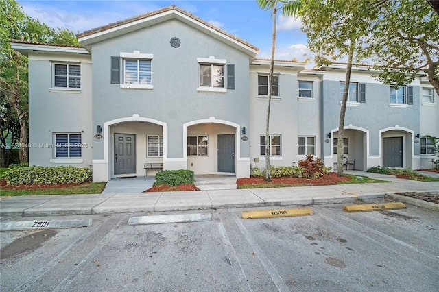 2903 SE 15th Ter, Homestead, FL 33035 - view of property featuring stucco siding and uncovered parking