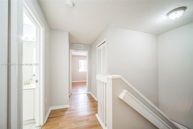 2903 SE 15th Ter, Homestead, FL 33035 - hall featuring an upstairs landing and light wood-style floors