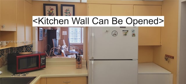 3475 S Ocean Blvd Unit 611, Palm Beach, FL 33480 - kitchen with freestanding refrigerator and light countertops