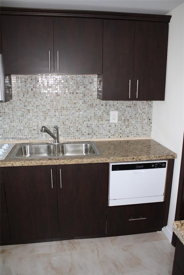 2930 Point E Dr Unit E309, Aventura, FL 33160 - kitchen with dishwasher, dark brown cabinetry, and backsplash