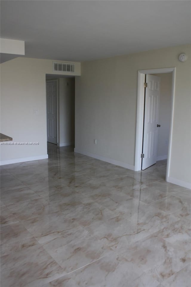 2930 Point E Dr Unit E309, Aventura, FL 33160 - unfurnished room with marble tiled flooring and a smoke detector