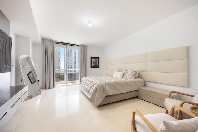 901 Brickell Key Blvd Unit 2506, Miami, FL 33131 - bedroom with a wall of windows, light tile patterned floors, and access to outside