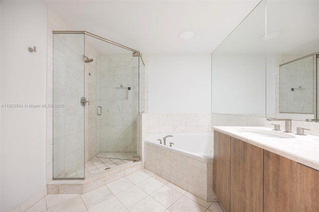 901 Brickell Key Blvd Unit 2506, Miami, FL 33131 - bathroom with a garden tub, a shower stall, vanity, and tile patterned floors