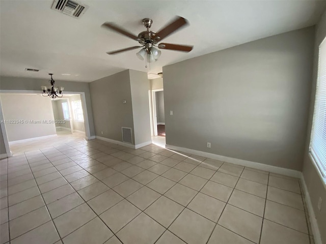 4625 SW 32nd Dr, West Park, FL 33023 - spare room with light tile patterned flooring, a chandelier, and ceiling fan