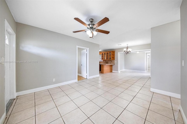 4625 SW 32nd Dr, West Park, FL 33023 - unfurnished living room featuring a chandelier, ceiling fan, and light tile patterned floors