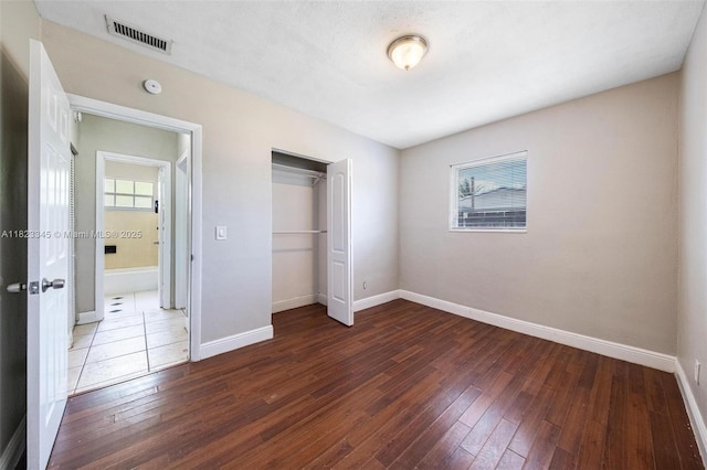 4625 SW 32nd Dr, West Park, FL 33023 - unfurnished bedroom with hardwood / wood-style floors and a closet