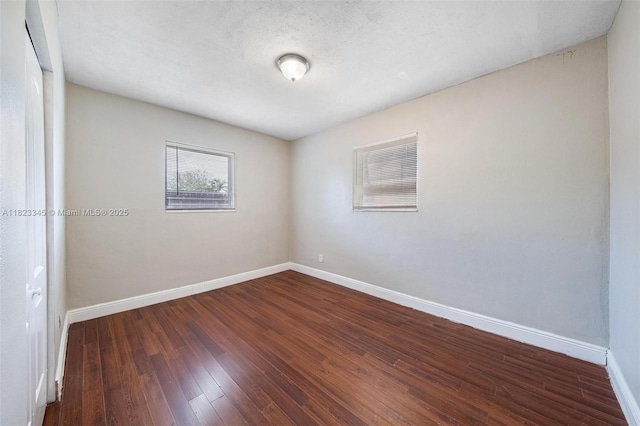 4625 SW 32nd Dr, West Park, FL 33023 - empty room featuring baseboards and hardwood / wood-style floors