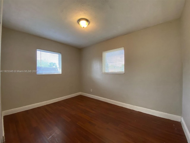 4625 SW 32nd Dr, West Park, FL 33023 - unfurnished room with baseboards and dark wood-style floors