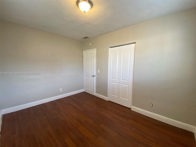 4625 SW 32nd Dr, West Park, FL 33023 - unfurnished bedroom with dark wood-style floors and a closet