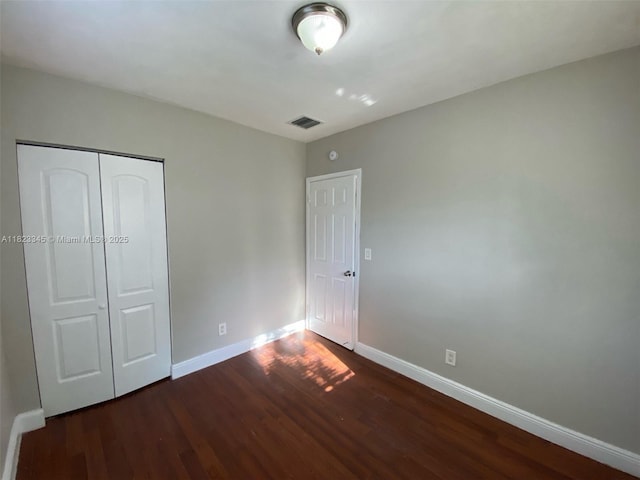 4625 SW 32nd Dr, West Park, FL 33023 - unfurnished bedroom featuring dark wood-style floors and a closet