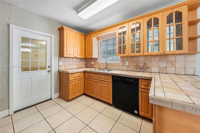 4625 SW 32nd Dr, West Park, FL 33023 - kitchen with black dishwasher, tile counters, decorative backsplash, light tile patterned floors, and glass insert cabinets
