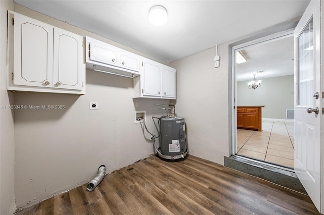4625 SW 32nd Dr, West Park, FL 33023 - laundry area with electric water heater, electric dryer hookup, cabinet space, wood finished floors, and hookup for a washing machine